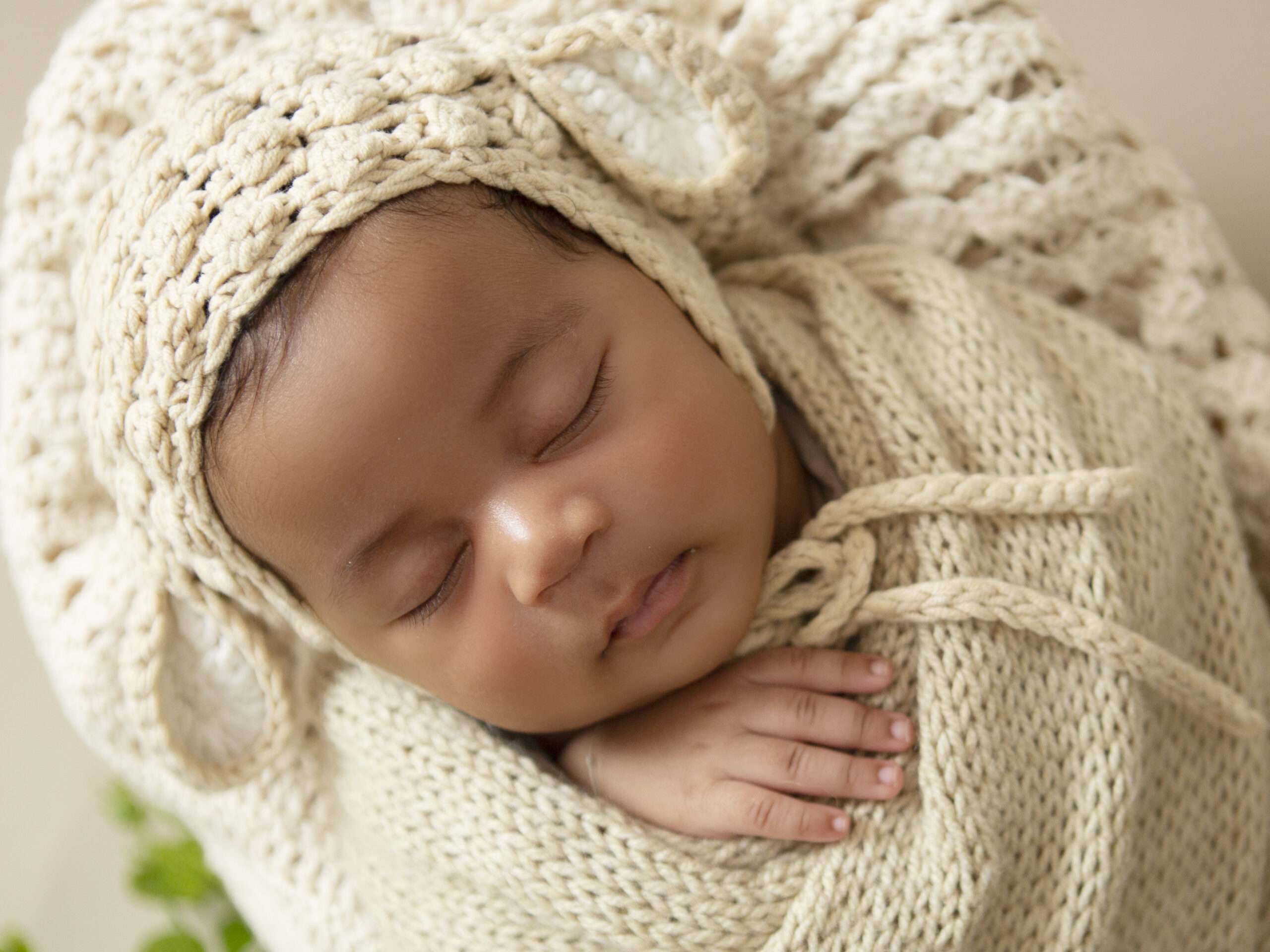 Charming newborn captured by Light Affair Photography, a trusted newborn photographer. Soft, natural light highlights the innocence and beauty of the baby during the photoshoot.