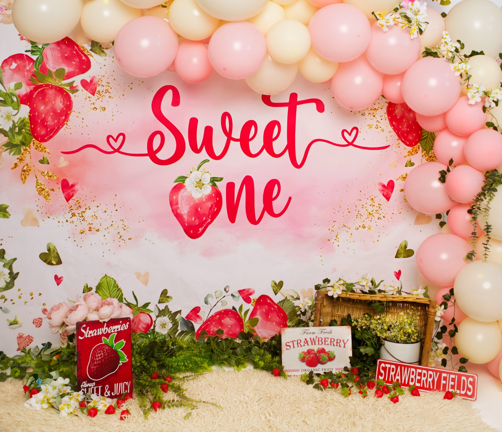 Light Affair Photography Strawberry Cake Smash Photoshoot Setup in Midrand – A beautifully decorated strawberry-themed cake sits in the center, surrounded by playful props, ready for a delightful cake smash photoshoot.